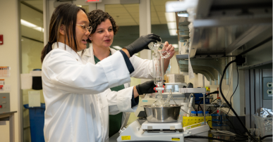 Two lab techs at work