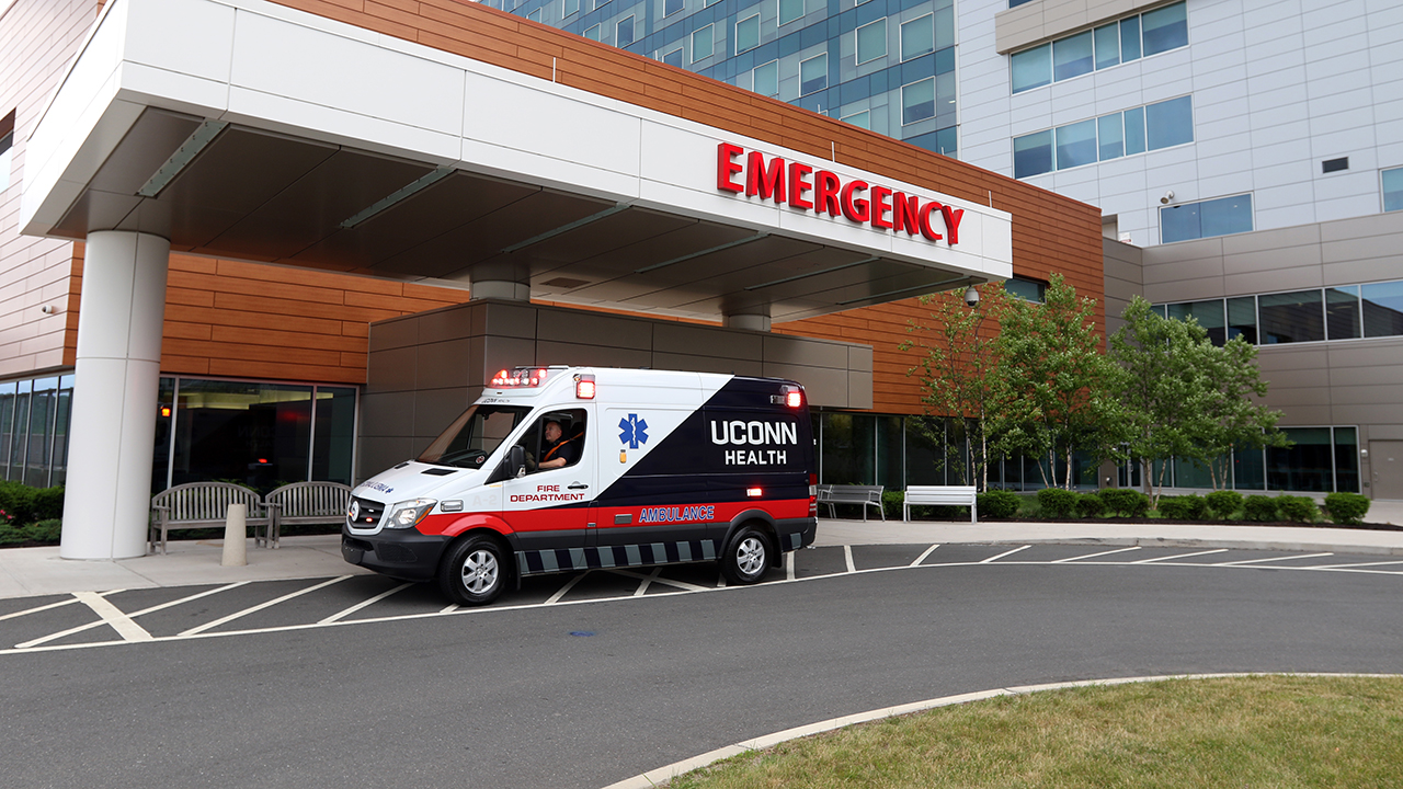 An ambulance in front of the UConn Health Emergency Department entrance