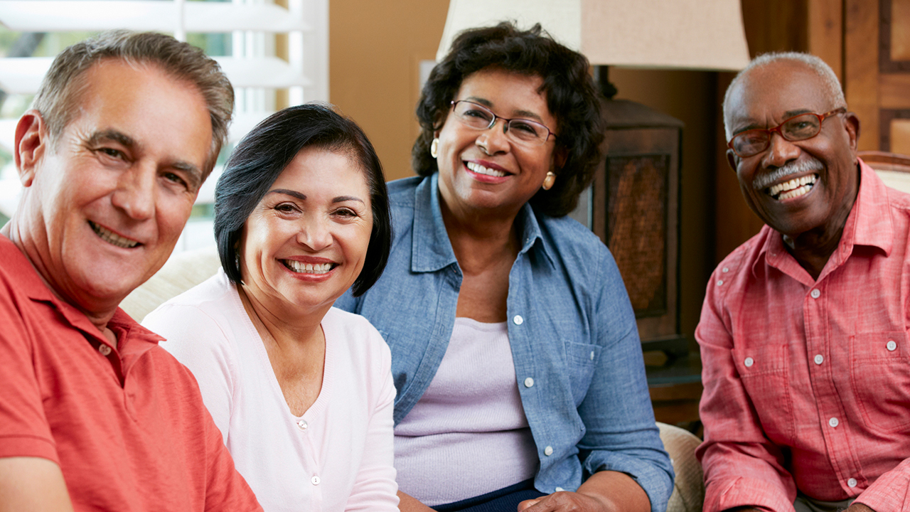 A group of senior friends at home together
